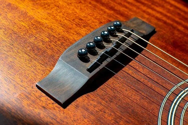 Where is the Saddle on an Acoustic Guitar